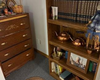 More MCM decor. Pope picture. Nice dovetail dresser. A vintage hard cover Google system. Brass tea pots. 