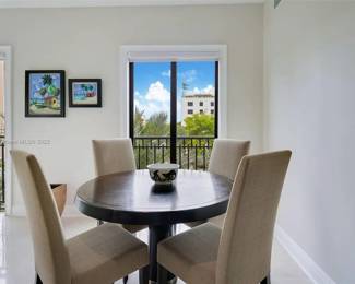 Artefacto Dining Table (appx Diameter 471/4”x291/4”)  and four (4) Artefacto High Back Armless Chairs @W18 1/2x D22 xH41 3/4)