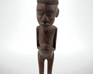 An African Carved Wood Sculpture Of A Kneeling Man
