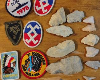 Arrowheads and military patches.