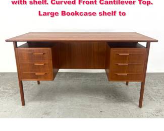 Lot 173 Danish Modern teak six drawer desk with shelf. Curved Front Cantilever Top. Large Bookcase shelf to 