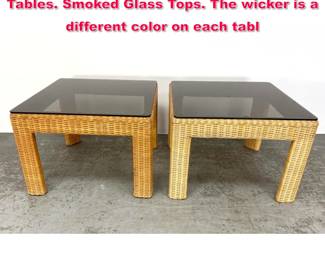 Lot 551 2pc Woven wicker Square Side Tables. Smoked Glass Tops. The wicker is a different color on each tabl