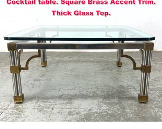 Lot 530 Regency style Chrome Glass Cocktail table. Square Brass Accent Trim. Thick Glass Top. 