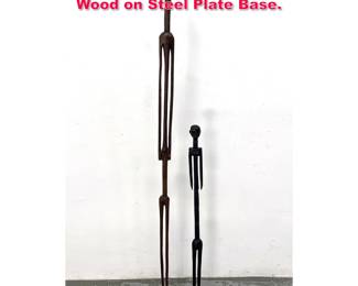 Lot 134 2pcs Tall Narrow African Sculptures. Wood on Steel Plate Base. 