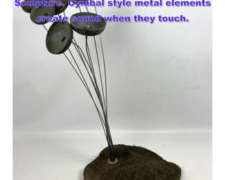 Lot 718 Modernist Oxidized Metal Flora Sculpture. Cymbal style metal elements create sound when they touch. 