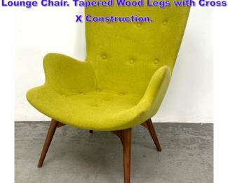 Lot 1100 Contemporary Tall Sculpted Back Lounge Chair. Tapered Wood Legs with Cross X Construction.
