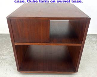 Lot 942 Revolving Modernist Walnut book case. Cube form on swivel base. 