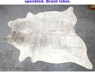 Lot 1094 Brazilian Animal Hide Rug. Metallic speckled. Brazil label. 