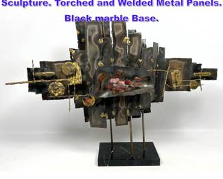 Lot 606 Welded Mixed Metal Brutalist Table Sculpture. Torched and Welded Metal Panels. Black marble Base.