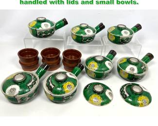 Lot 1494 lot of small cook pots. Asian style handled with lids and small bowls. 
