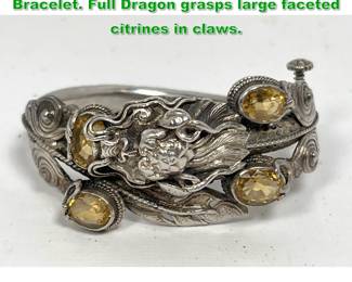 Lot 1318 Sterling Silver Ornate Hinged Cuff Bracelet. Full Dragon grasps large faceted citrines in claws. 