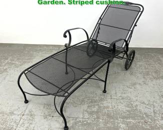 Lot 1654 Black Iron Chaise Lounge. Outdoor Garden. Striped cushion.