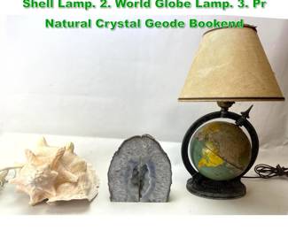 Lot 1719 Mixed Shelf Lot. Large 1. Conch Shell Lamp. 2. World Globe Lamp. 3. Pr Natural Crystal Geode Bookend