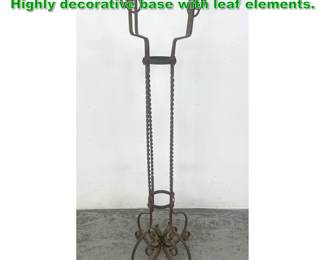Lot 1631 Vintage Wrought Iron Plant Stand. Highly decorative base with leaf elements.