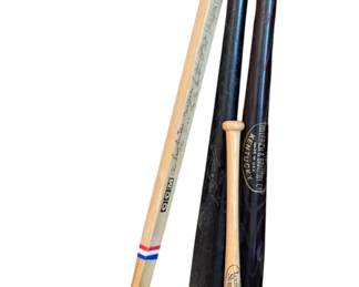 Assorted Wooden Bats And Hockey Stick