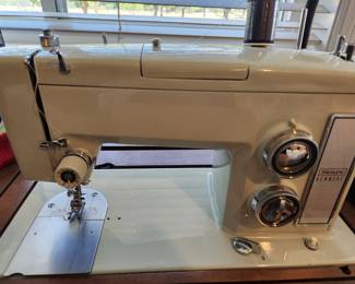 Sears Kenmore Sewing Machine in a Cabinet with Drawers.