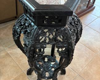 Black carved wood Asian style plant stand. 18”w 16”d 32”t.