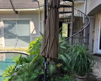 Adjustable Brown Umbrella with base and cover. 8’6”T 36”base Span 11’
$200.00