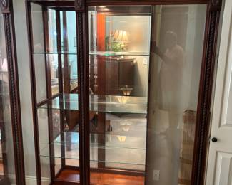 2) matching Pulaski 2-way sliding door, lighted, Curio Cabinets. 42.75”w 16.25”d 79.5”t. $600.00 each
