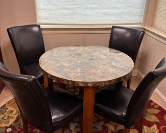 Round kitchen table (4) black vinyl chairs. Tbl: 40” diameter 29.5” t chairs: 19” w 17”d 38”t. $ 225.00