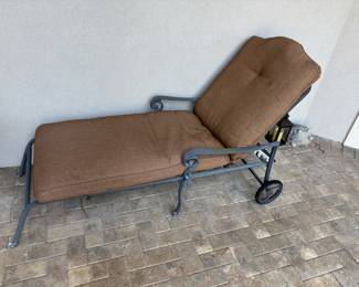 Cast Aluminum lounger with cushion 76”L 27.5”w 17”-40”t. $125.00