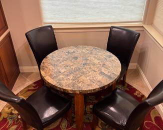 Round kitchen table (4) black vinyl chairs. Tbl: 40” diameter 29.5” t chairs: 19” w 17”d 38”t. $ 225.00