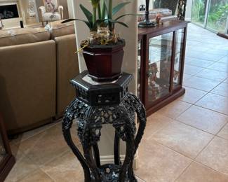 Black carved wood Asian style plant stand. 18”w 16”d 32”t.