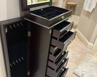Black jewelry chest 9 compartments 2 doors. 17”w 10.25”d 40.5”t
$ 175.00
