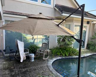 Adjustable Brown Umbrella with base and cover. 8’6”T 36”base Span 11’
$200.00