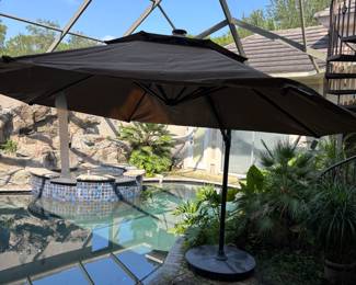 Adjustable Brown Umbrella with base and cover. 8’6”T 36”base Span 11’
$200.00