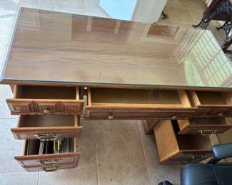 Desk faux wood finish glass top 9 drawers. 52”w 22”d 30.5”t $ 75.00