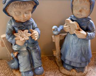 Large ceramic boy and girl garden figurines