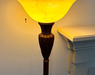 Copper-tone floor lamp with frosted glass shade