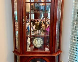 Lighted cherry wood corner curio cabinet