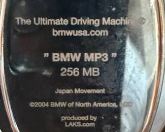 Back of BMW watch reads as follows: BMW "The Ultimate Driving Machine, 256 MB, Japan Movement, c 2004 BMW of North America, LCC, Produced by LAKS.Com, FC<CM
