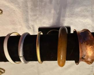 Variety of Bracelets including Hand Hammered Copper on the far right