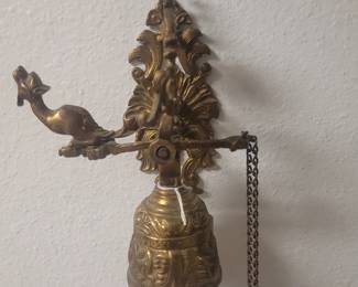 Antique brass pull bell. Every estate needs one to call the servants.