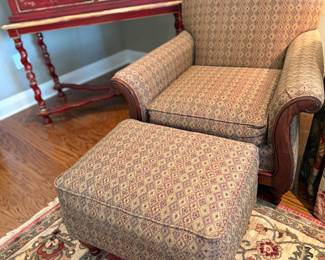 One of a Pair of Stylized Club Chairs with ottoman
