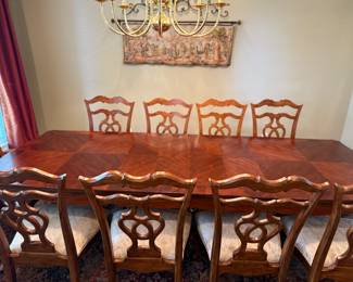 Dining table with 10 chairs, 2 leaves and custom table pads