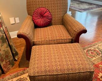 One of a Pair of Stylized Club Chairs with ottoman