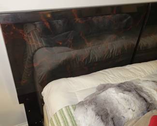 Black lacquer headboard with red stylization.