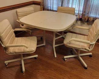 80 Style formica topped kitchen table with roller charis
