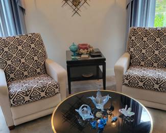 La-Z-Boy recliners. Round brass and smoked glass coffee table with swivel top.
