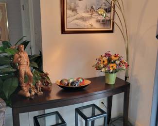 Black console table. Small glass topped black end tables.