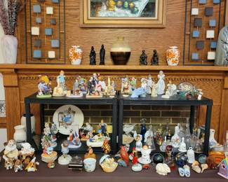 Collection of Norman Rockwell figurines. Bell collection and various figurines.