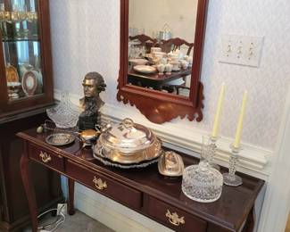 Formal buffet. Silver plate serving pieces. Formal mirror.