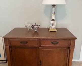 This cabinet pulls out to make a very long table