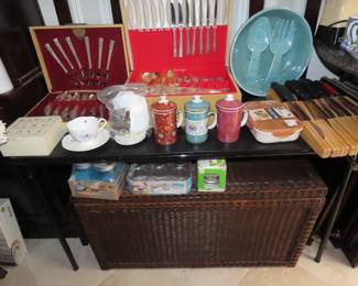 Two sets of silverplate flatware, kitchen knives and third storage trunk.