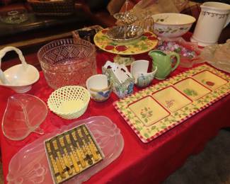 Table and shelves of porcelain, lead crystal, vintage stemware, serving dishes and decorative dishes.