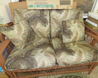 Like new 6 Piece resin faux wicker patio conversation set with two chairs, loveseat, 2 end tables, coffee table, cushions and area rug.